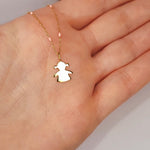 9ct Gold Little Girl Pendant on 9ct Gold chain with Pink Enamel detail in a persons hand