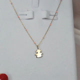 close up 9ct Gold Little Girl Pendant on 9ct Gold chain with Pink Enamel detail