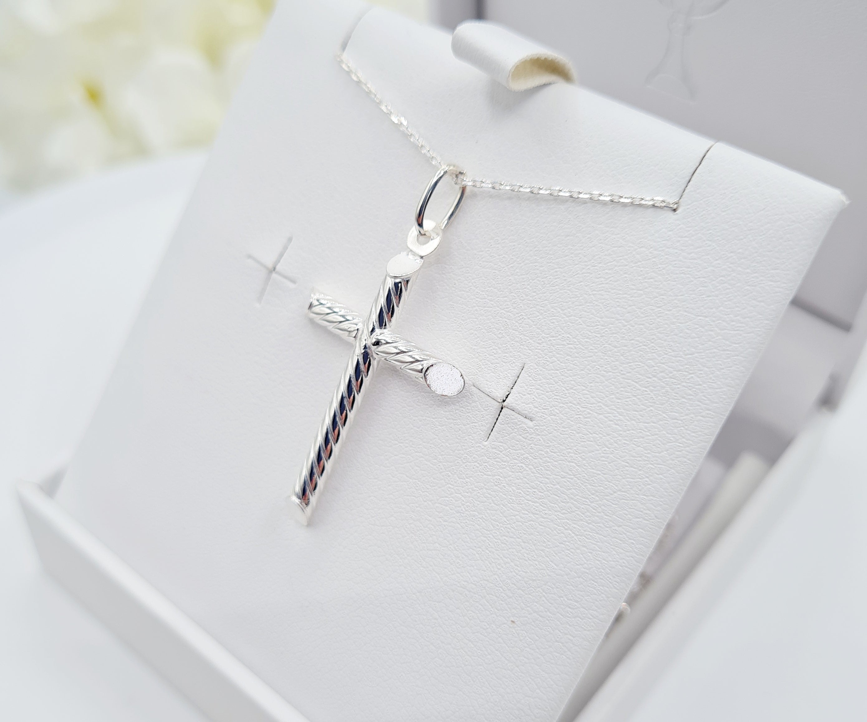 Close up of Sterling Silver Cross with Rope Design for Holy communion jewellery for boys and girls