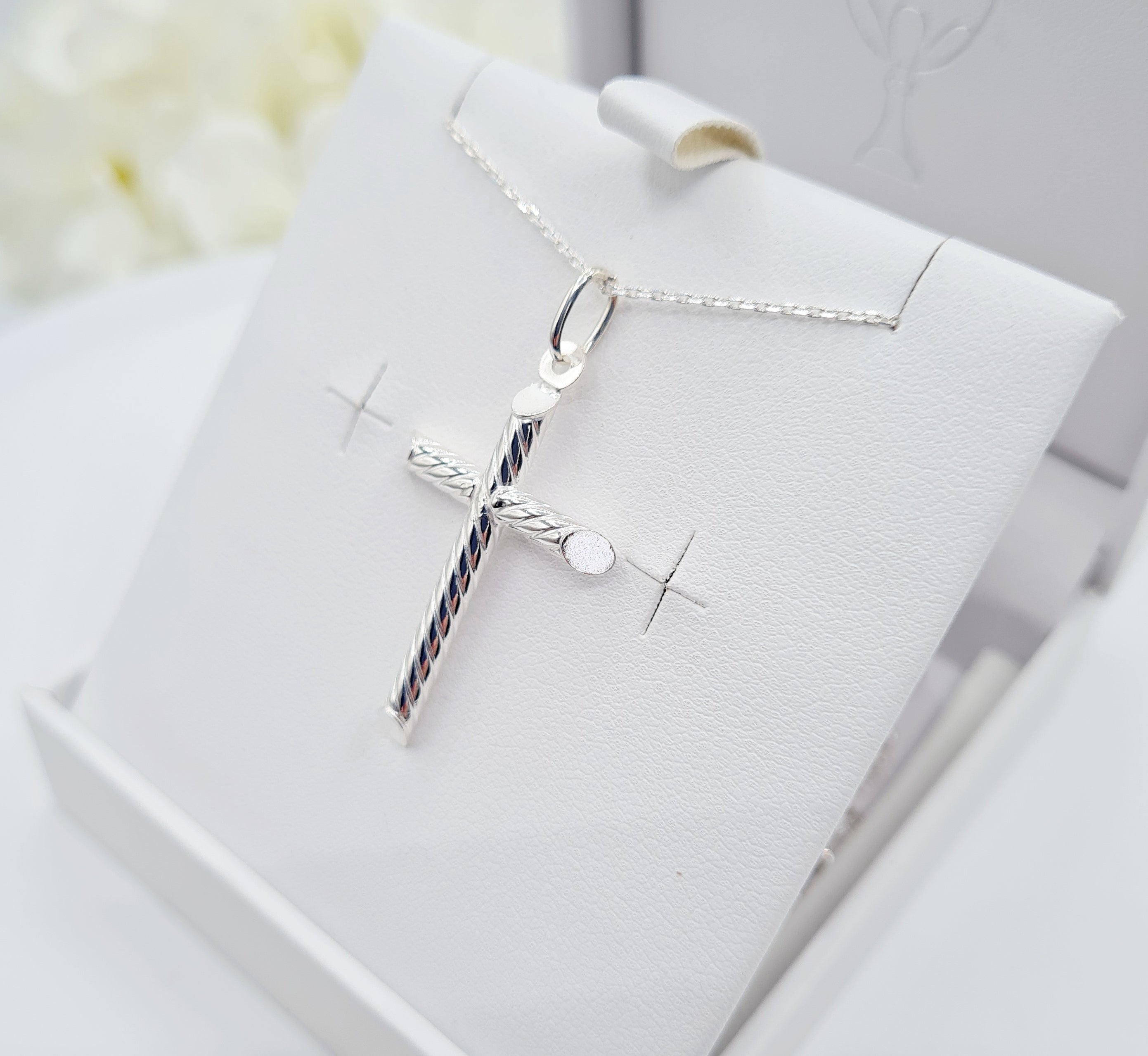 Close up of Sterling Silver Cross with Rope Design for Holy communion jewellery for boys and girls