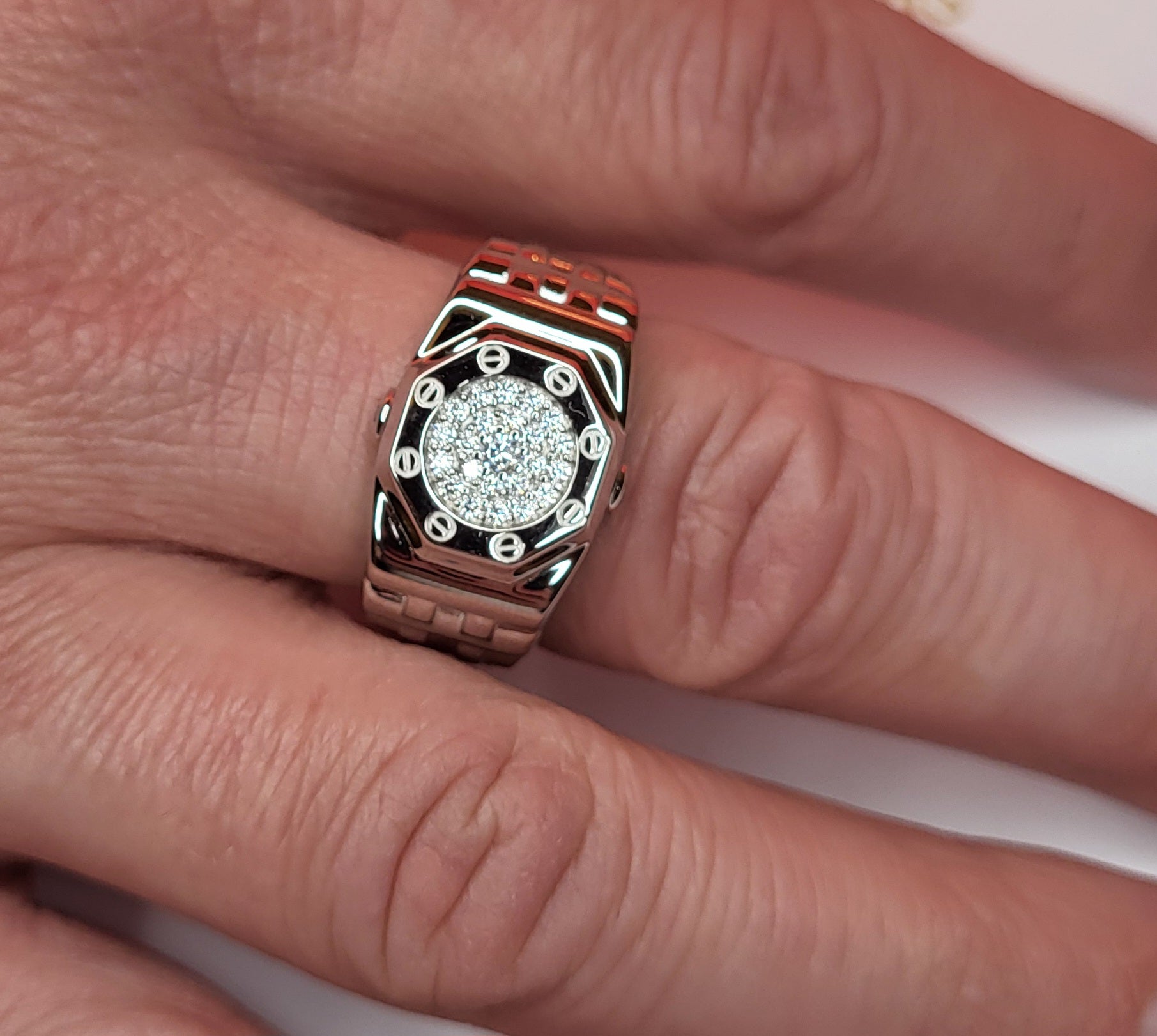 Close up of Mens Sterlng silver ring with cz on mans hand