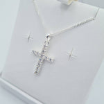 Close-up of sterling silver CZ cross pendant on chain – First Holy Communion jewellery