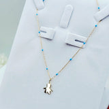 side view of 9ct Gold Little Boy Pendant on 9ct Gold Chain – Blue Enamel Detail